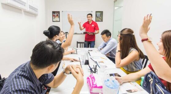 Small group english class. Teacher and 6 students